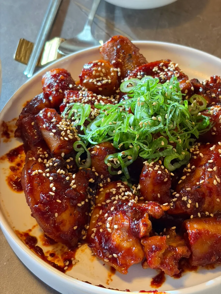 A plate of gochujang-seasoned pork tail jjim