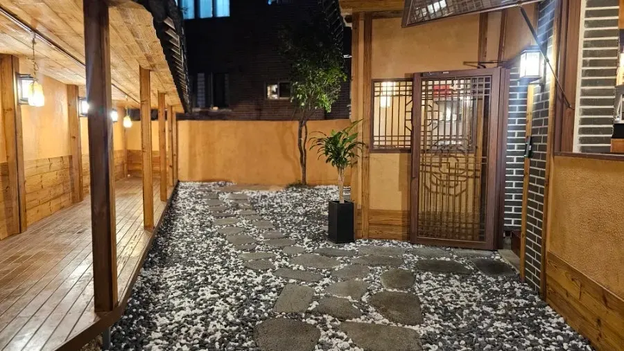 Cozy courtyard and stone path inside the gate, corridor under the eaves