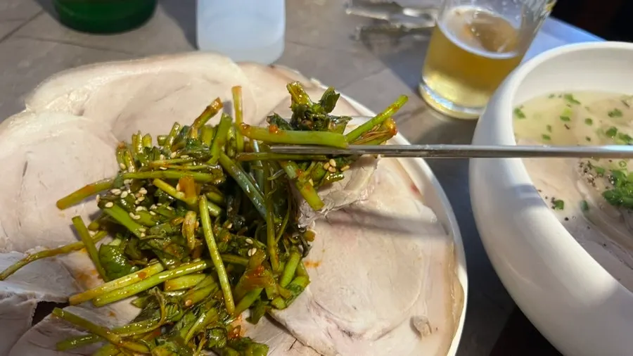 Warm pork plate served with seasoned minari