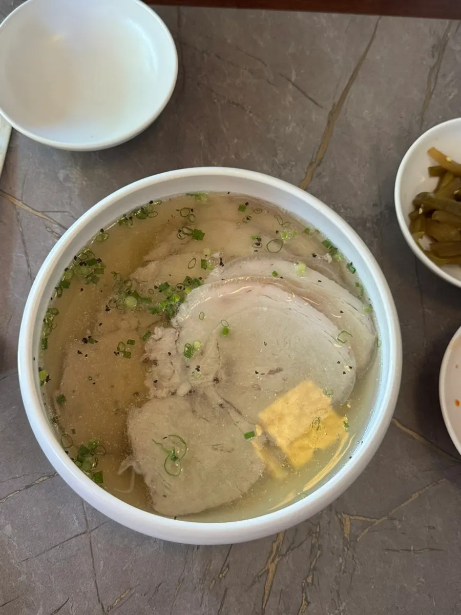 Anok's clear gomtang topped with generous chunks of meat