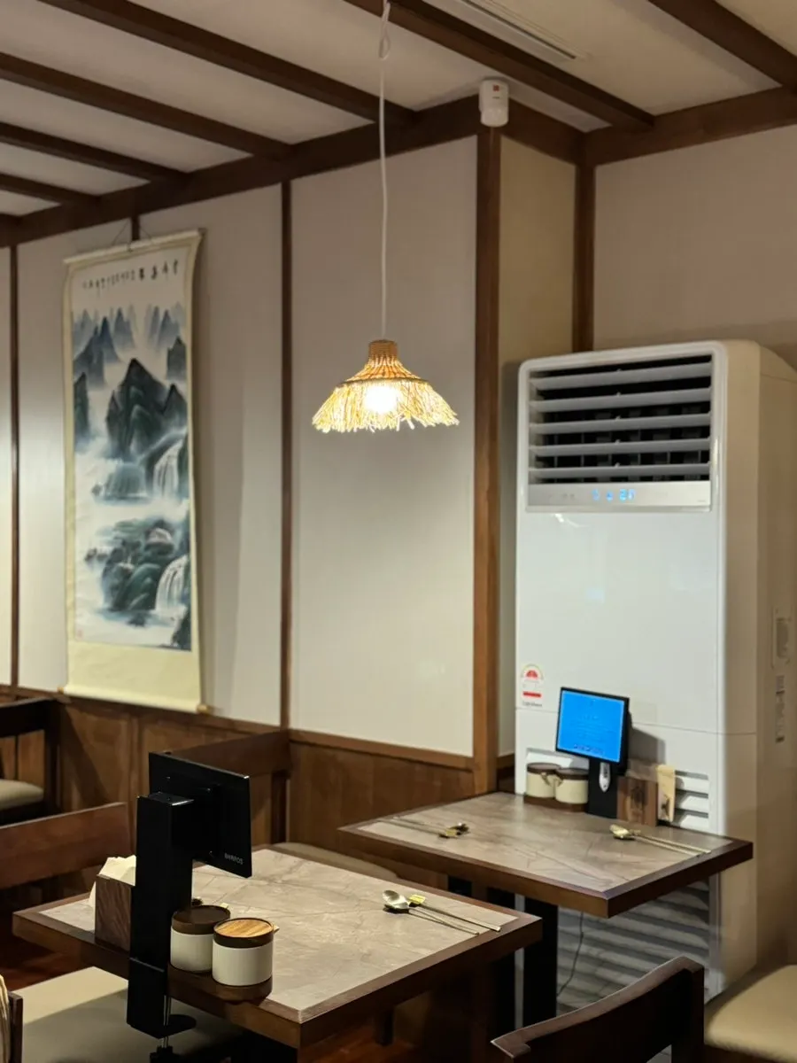 Inside Anok, with paintings and lighting