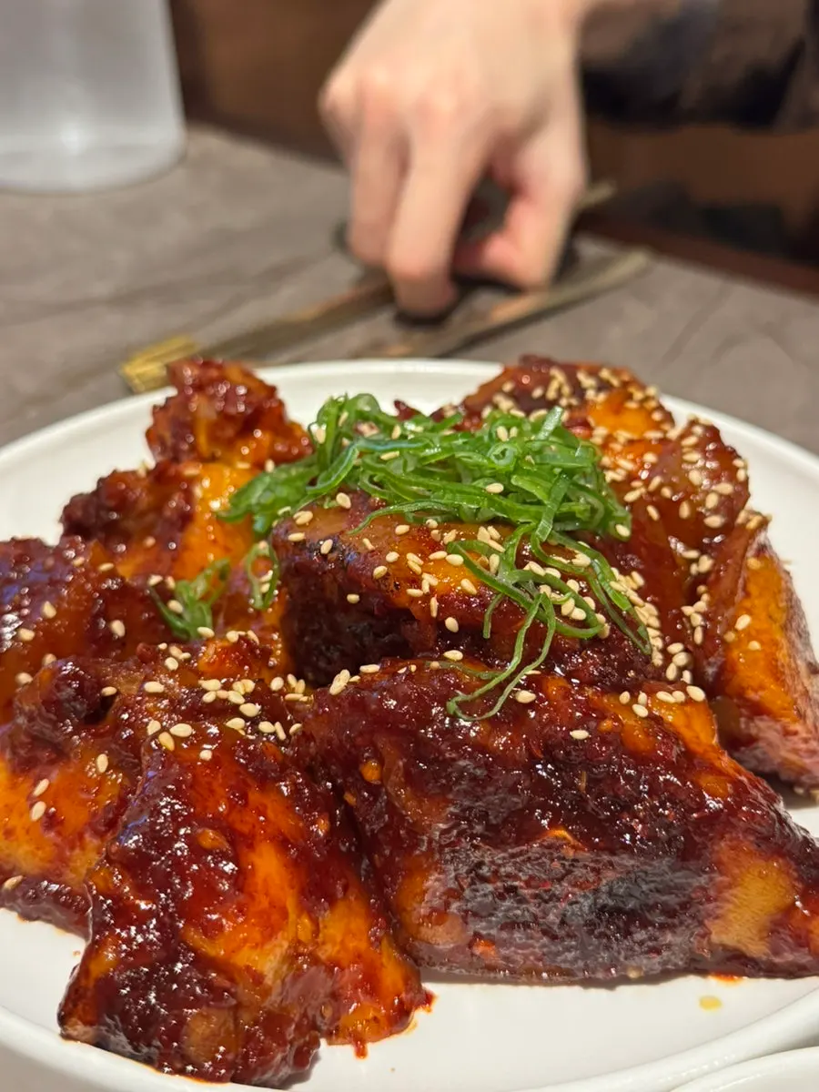 Anok's pork tail jjim with side dishes