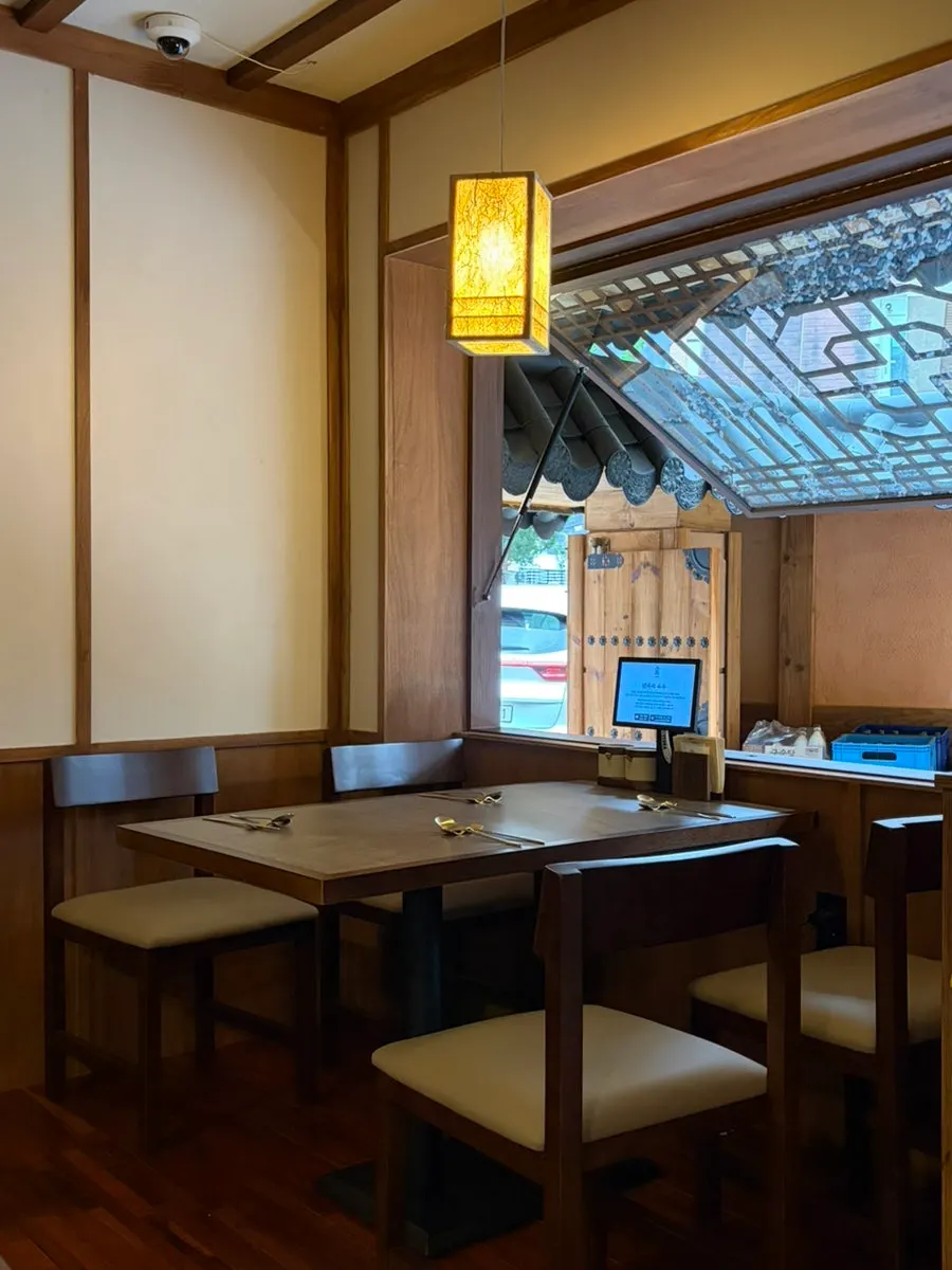 Neatly arranged table seating inside Anok