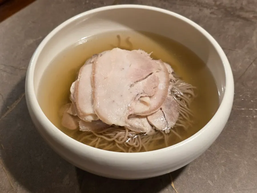 Bowl of Anok's Pyeongyang naengmyeon in broth