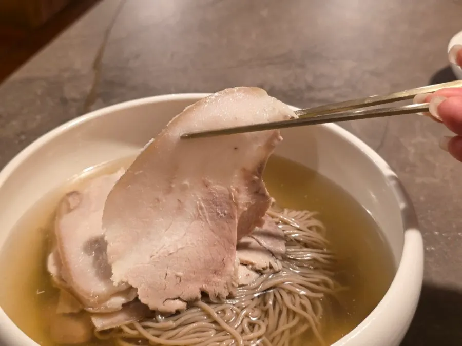 Naengmyeon topped with meat garnish