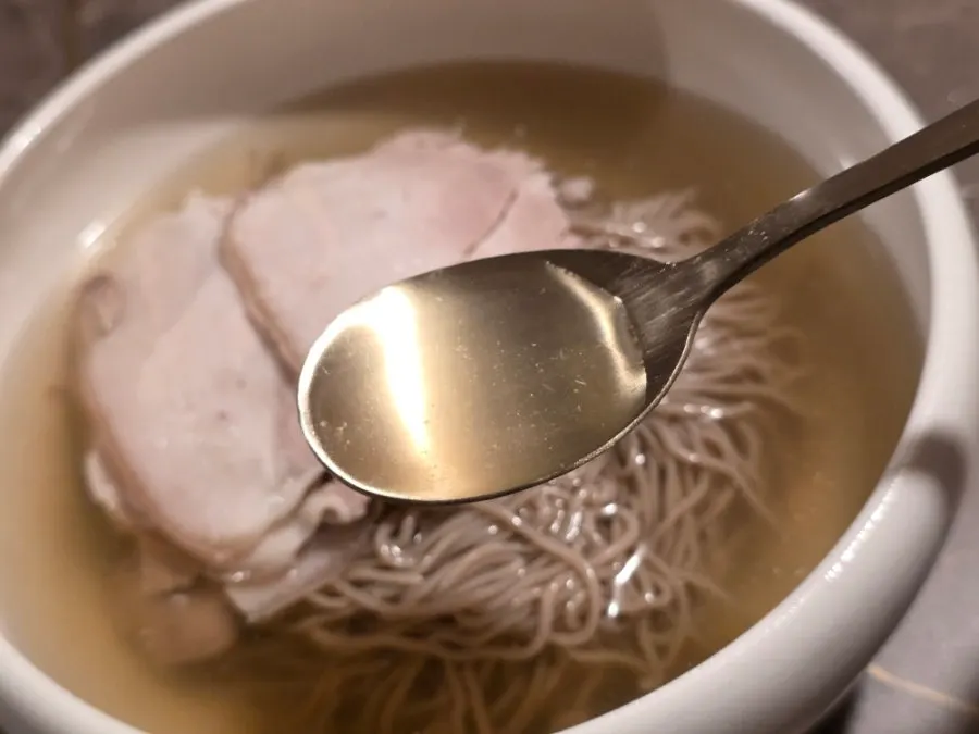 Lifting up a strand of naengmyeon noodles