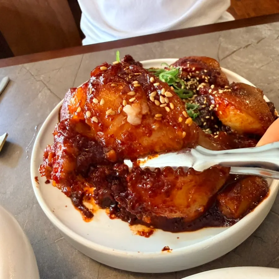 Close-up of the pork tail jjim meat and sauce