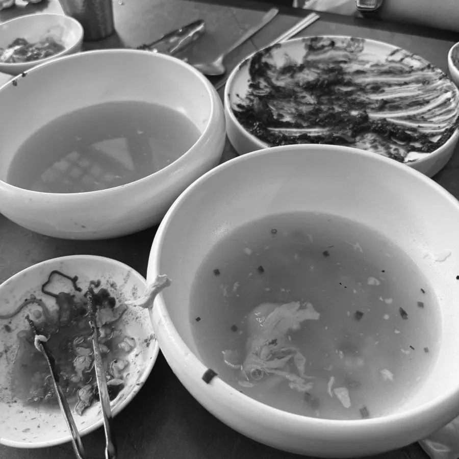 A soup bowl served with gungchae jangajji and radish kimchi