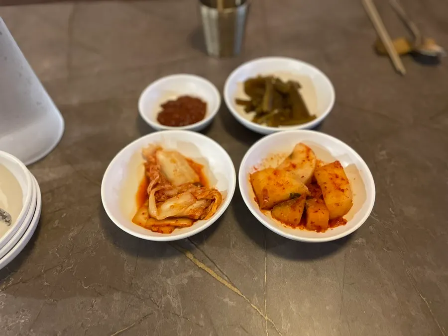 Side dishes neatly set on the table at Anok