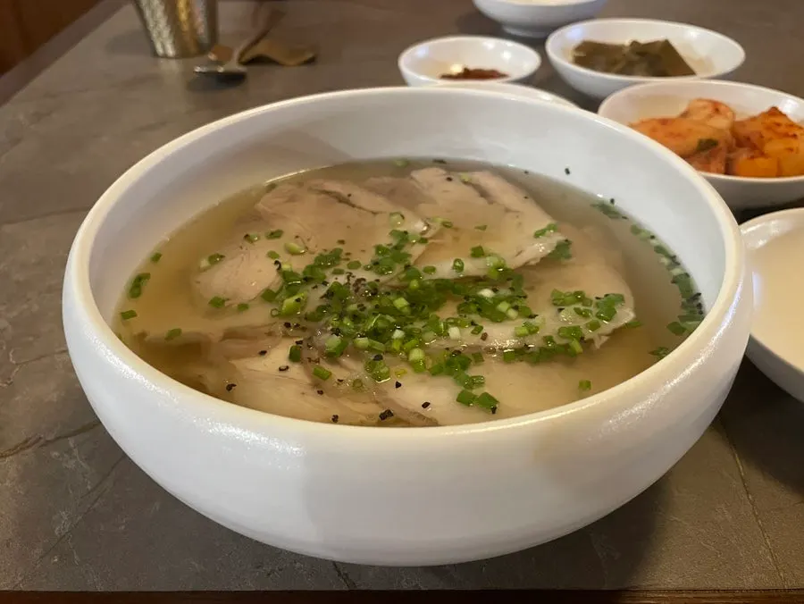 A bowl of Anok's clear pork gomtang topped with green onion