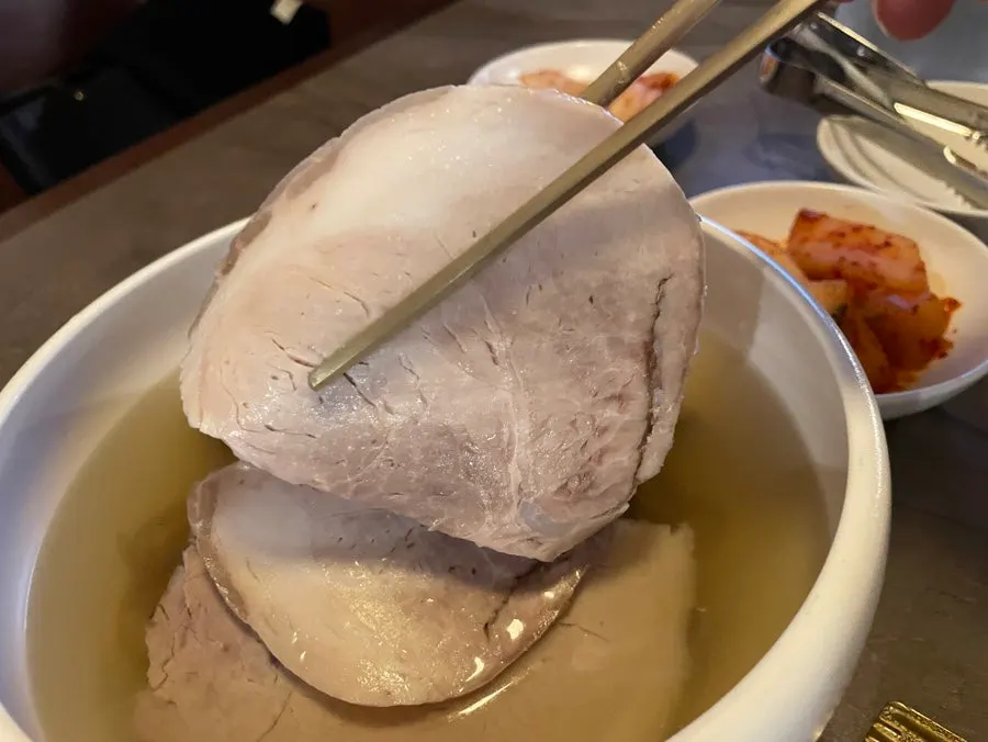 Close-up of buckwheat noodles and clear broth naengmyeon