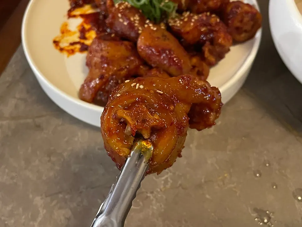 A full meal spread served alongside pork tail jjim
