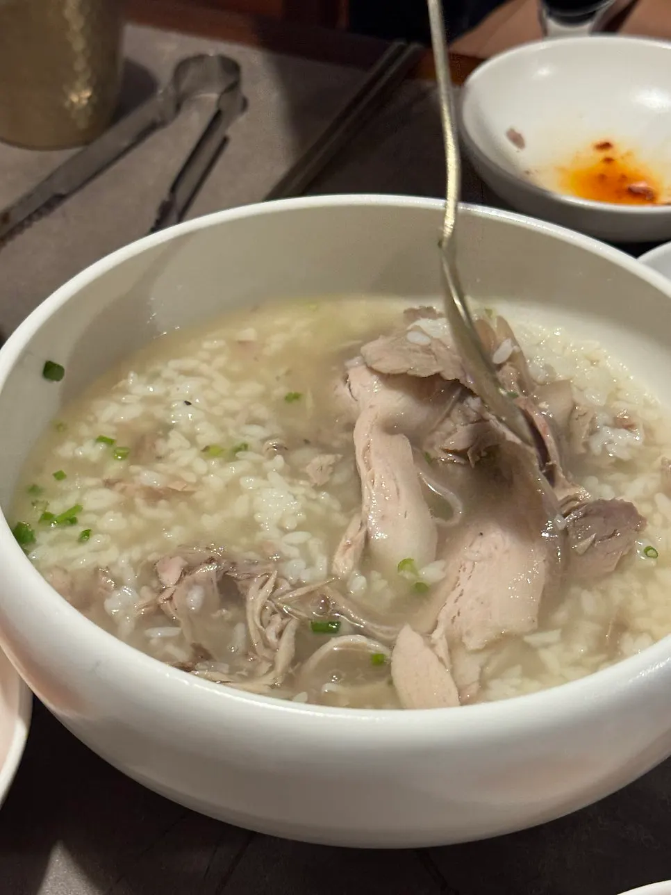 Clear gomtang served with rice already mixed in