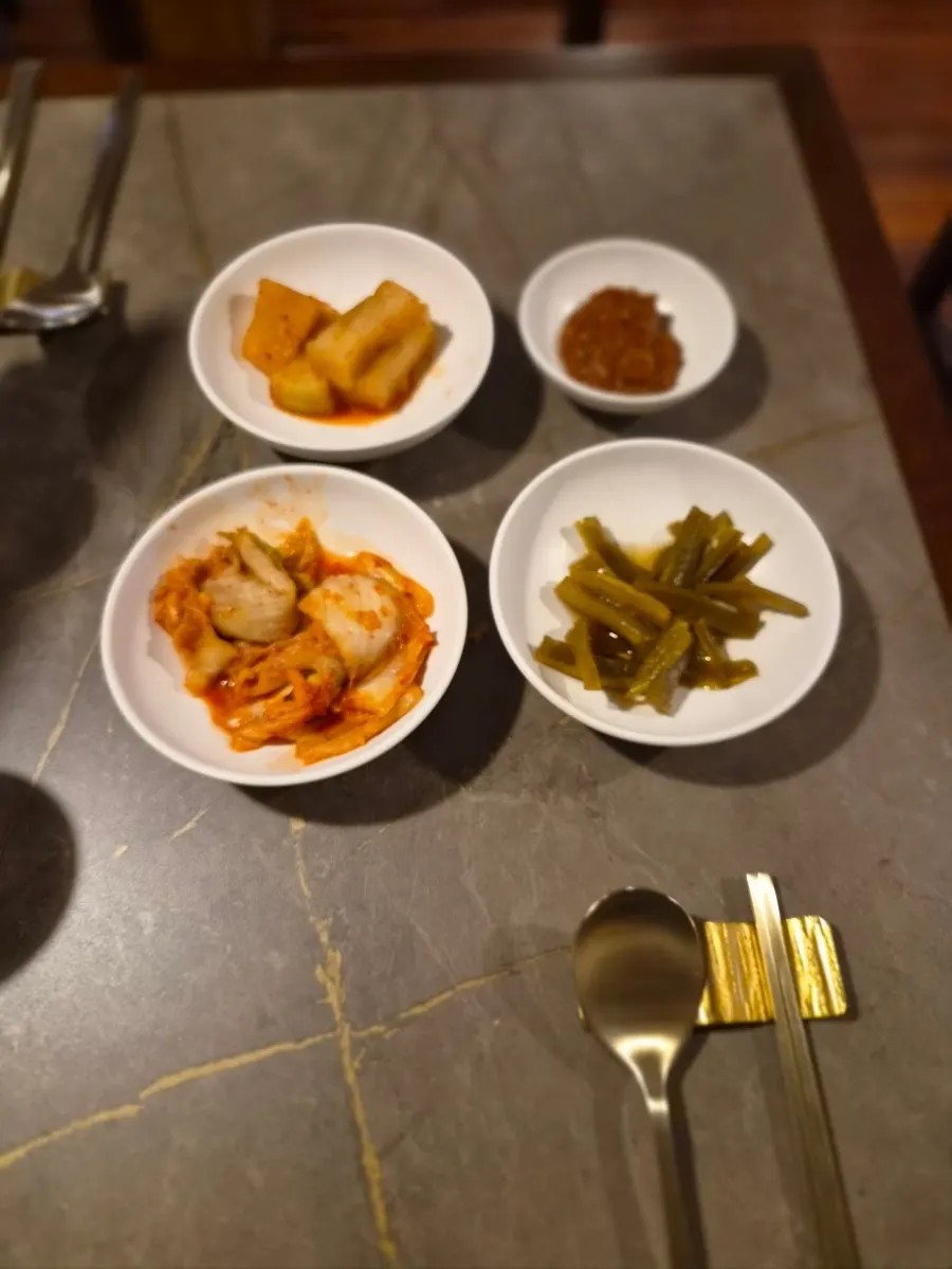 Basic side dishes: radish kimchi, cabbage kimchi, gungchae jangajji, and seasoning sauce