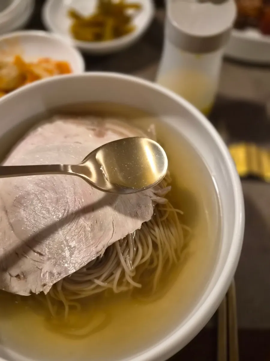 Buckwheat noodles lifted from the naengmyeon bowl