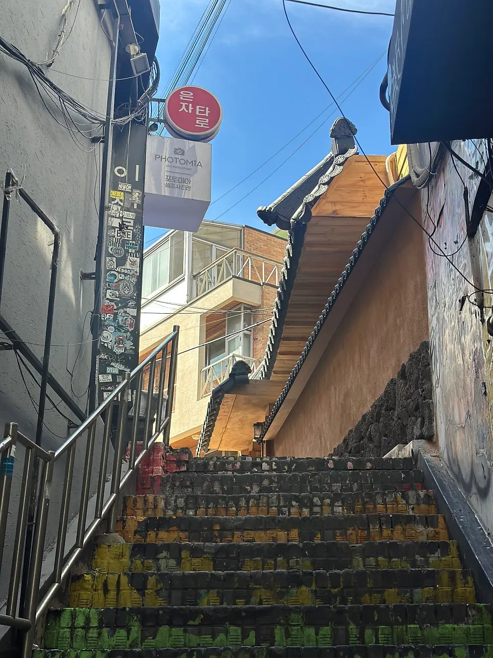 Exterior of Anok, a hanok restaurant up a Hongdae alley staircase