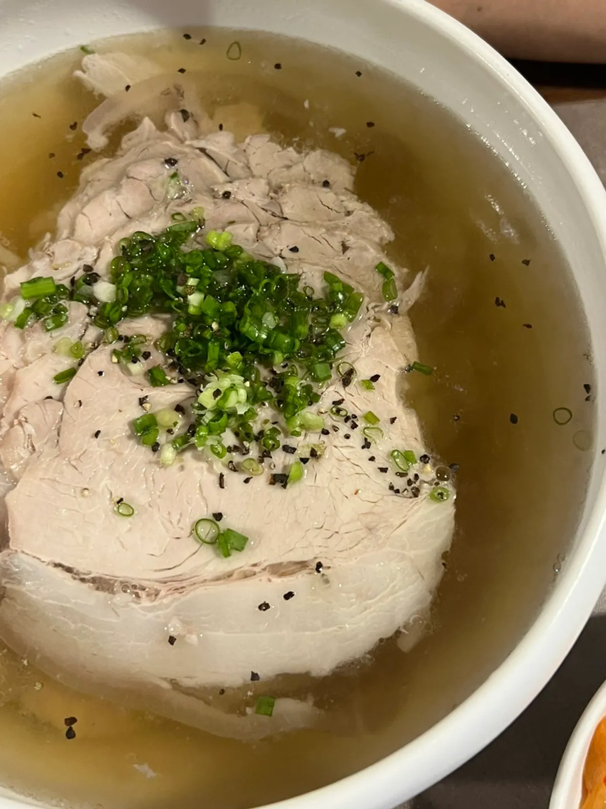 Signature shot of pork gomtang at Anok in Hongdae