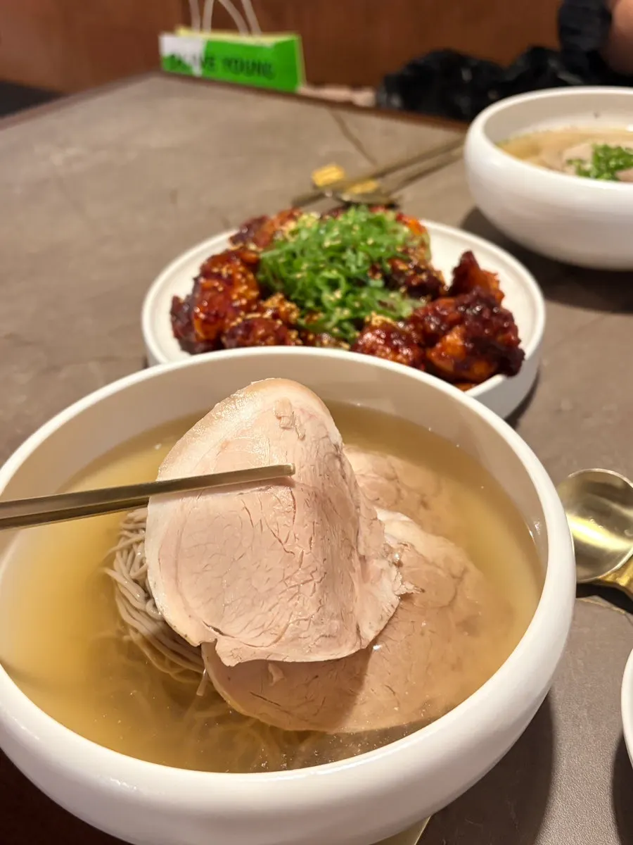 Chopsticks lifting Pyongyang naengmyeon noodles