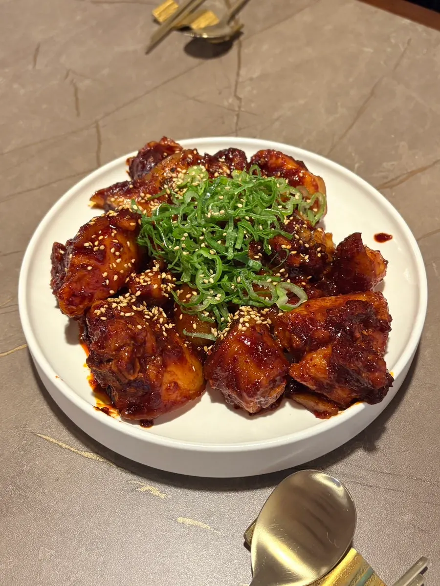 Table with hot gomtang and side dishes