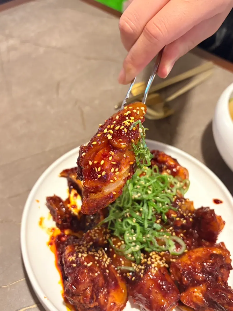 A table spread of naengmyeon, gomtang, and pork tail jjim