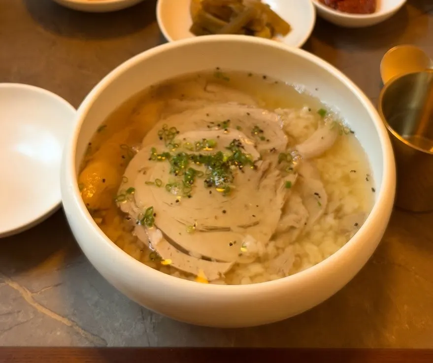 A table set with naengmyeon and side dishes