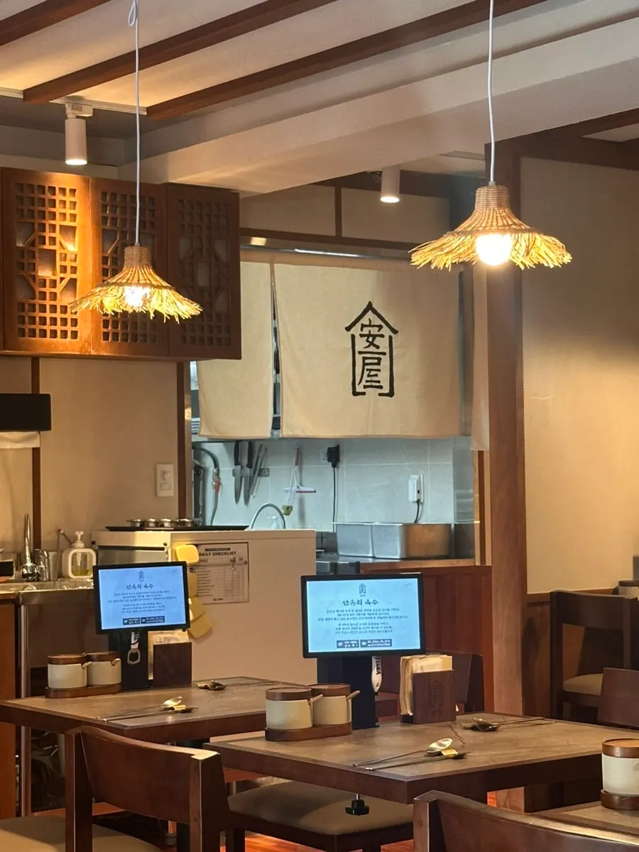 Anok's interior with wood tones and warm lighting