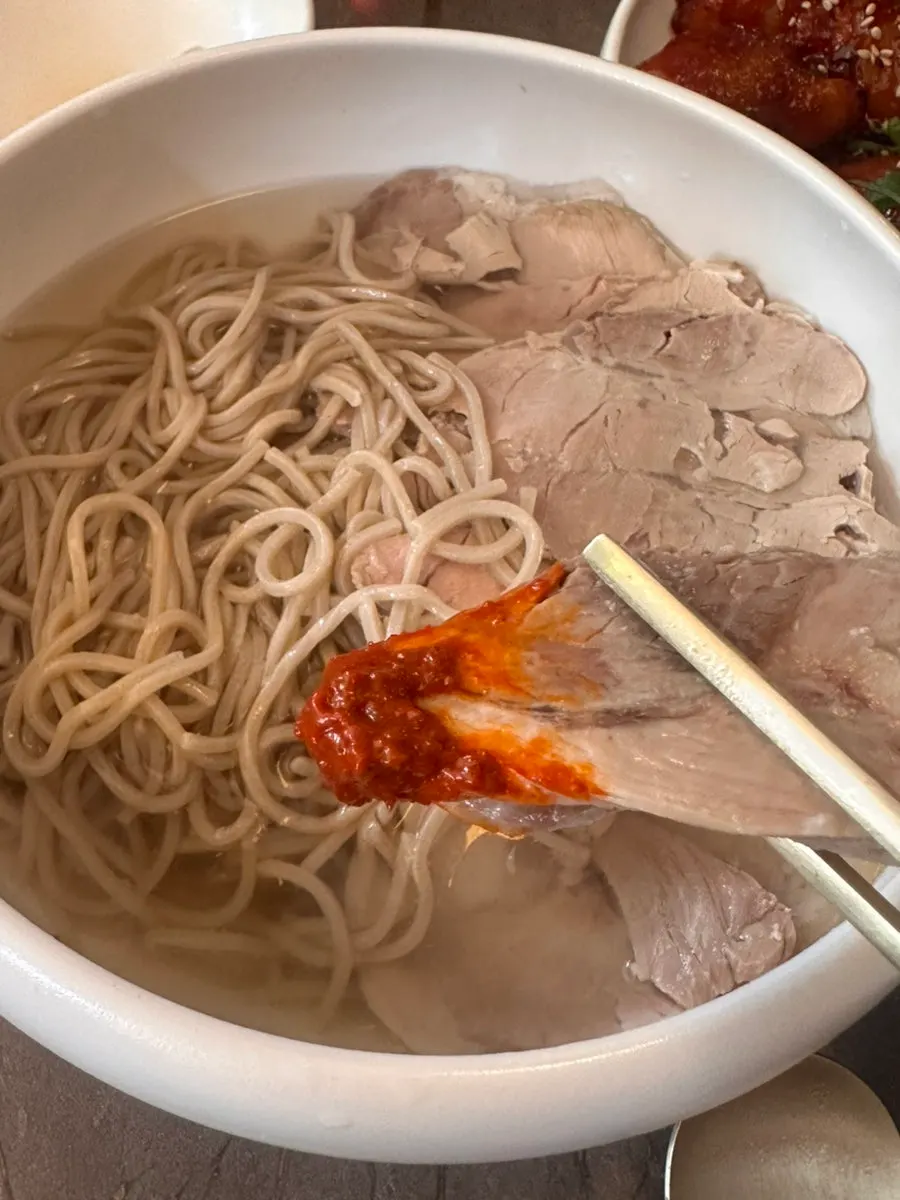 Noodles and meat lifted out of the Pyongyang naengmyeon