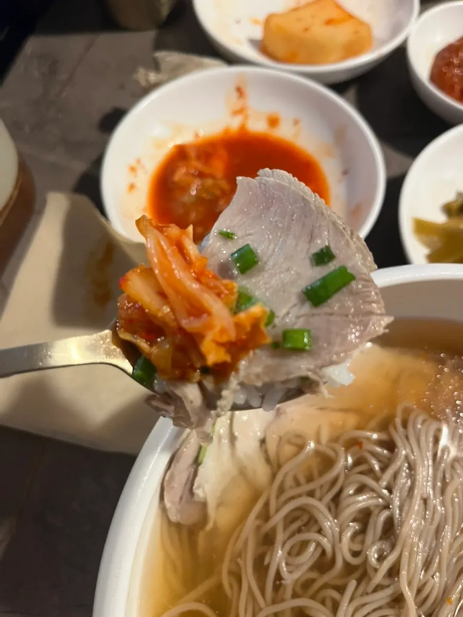 Inside the gomtang stone bowl packed with meat