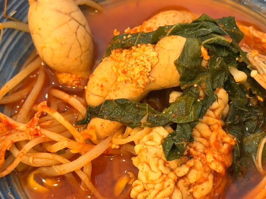 Enoki mushrooms and ingredients in fish roe stew