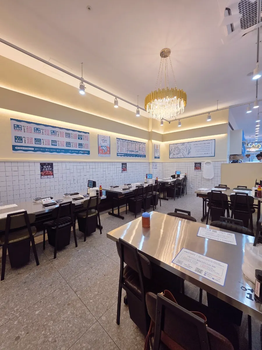 Sashimi restaurant interior with stainless-steel tables
