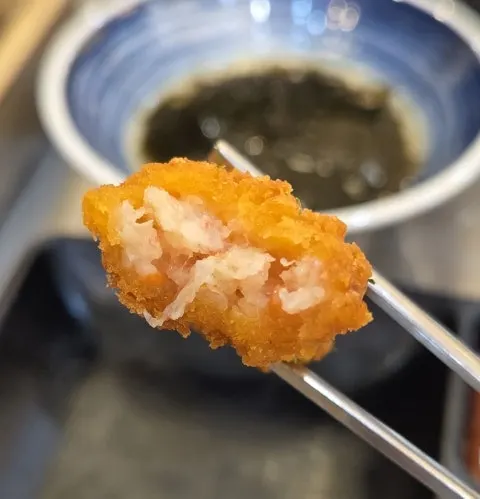 Close-up of crab meat inside the tempura