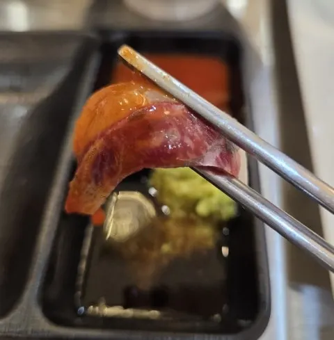 Eating sashimi wrapped like a lettuce wrap