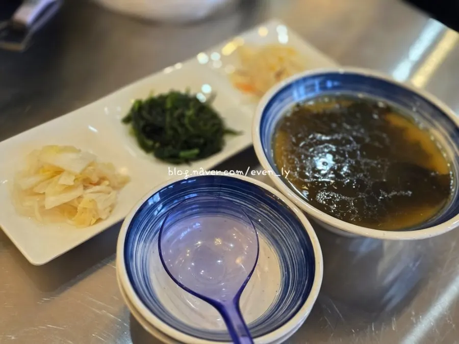 Side dish plate with seaweed salad and silkworm pupae