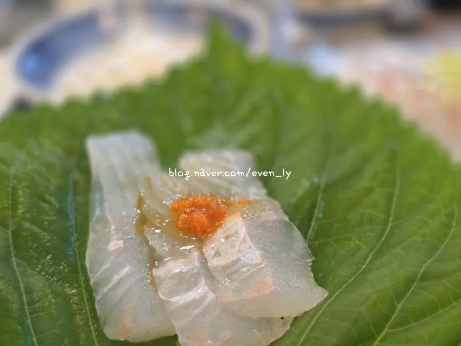 Sashimi placed on top of sushi rice, made fresh at the table