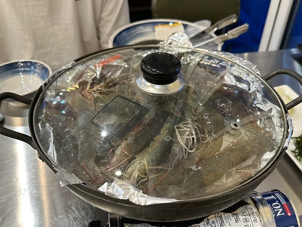 Live fresh shrimp placed on top of salt