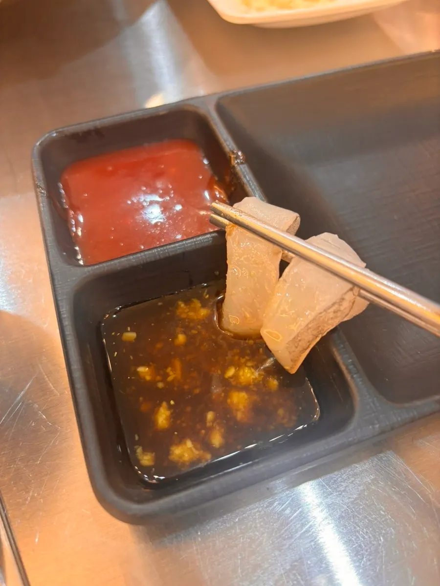 A chewy-textured piece of sashimi