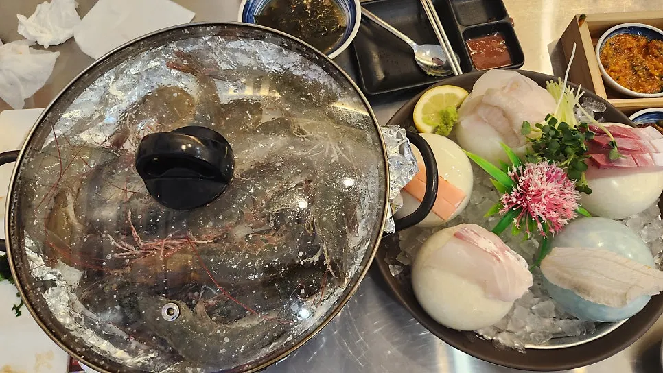 Fresh shrimp starting to grill on a bed of salt