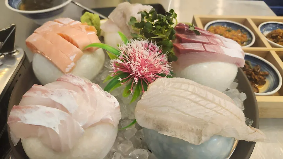 Close-up of thickly sliced live-fish sashimi