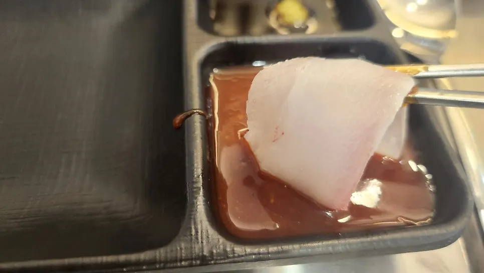 Plate with remaining salmon and flounder sashimi
