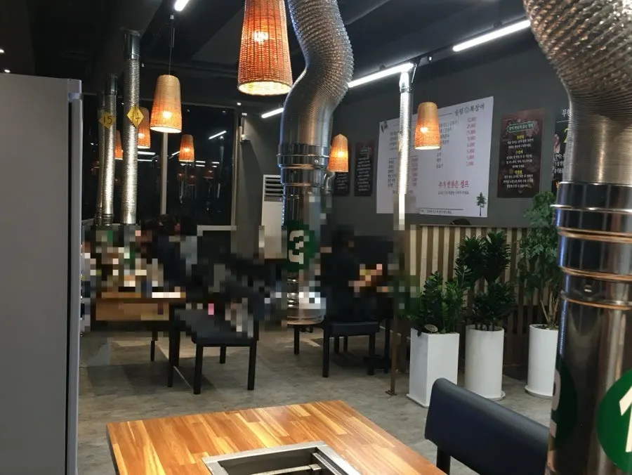 Spacious inner section of the restaurant with large tables