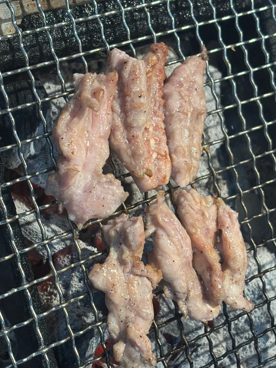 Chicken neck on the charcoal grill