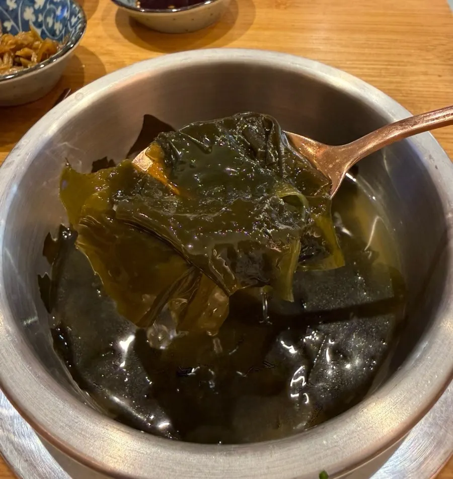 Warm seaweed soup served alongside the pot rice