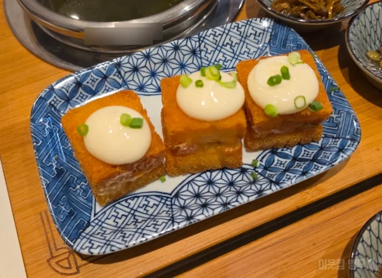 Pork cutlet served on top of the pot rice