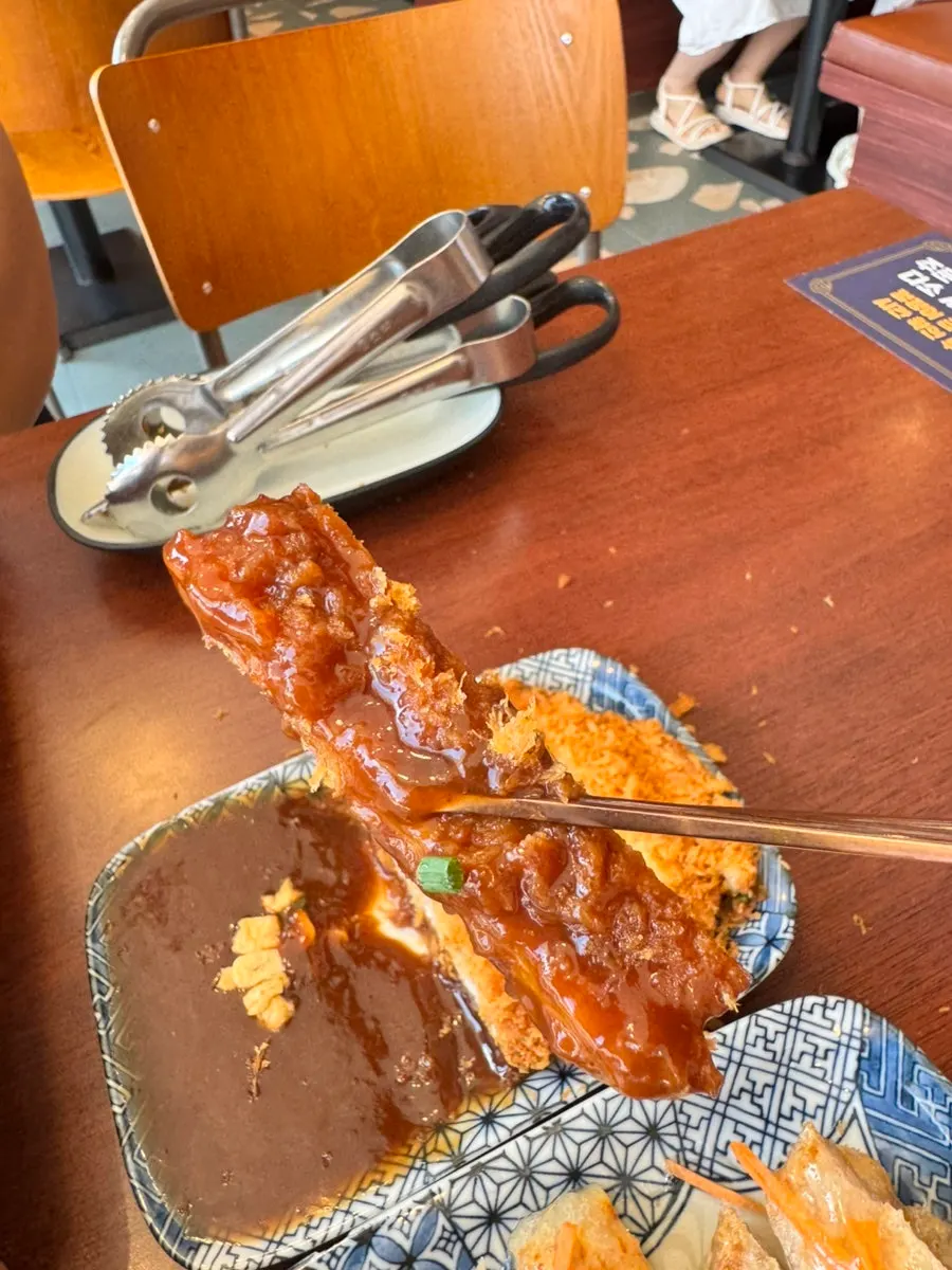 Crispy pork cutlet dipped in sauce