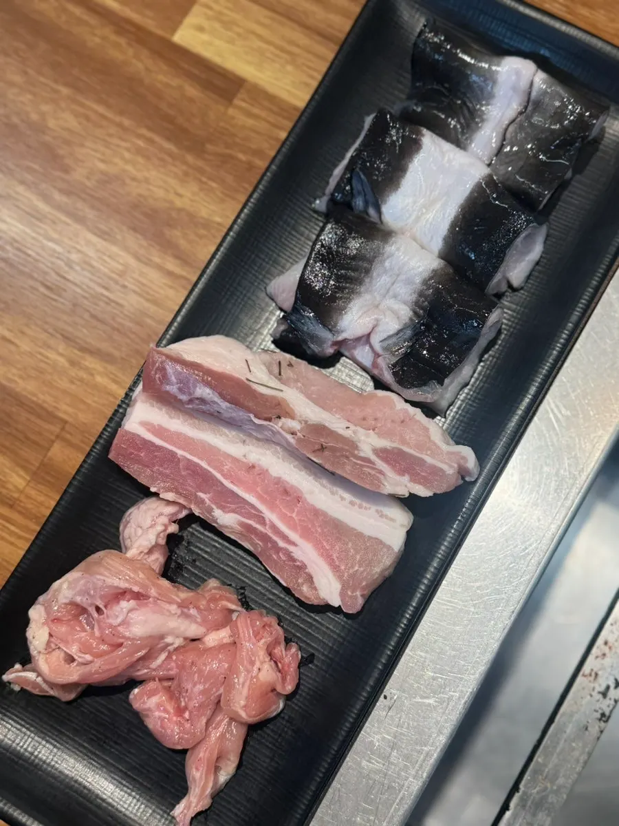 Initial plate of eel, pork belly, and chicken neck