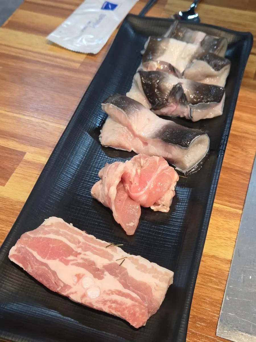 Plate of meats brought from the all-you-can-eat corner