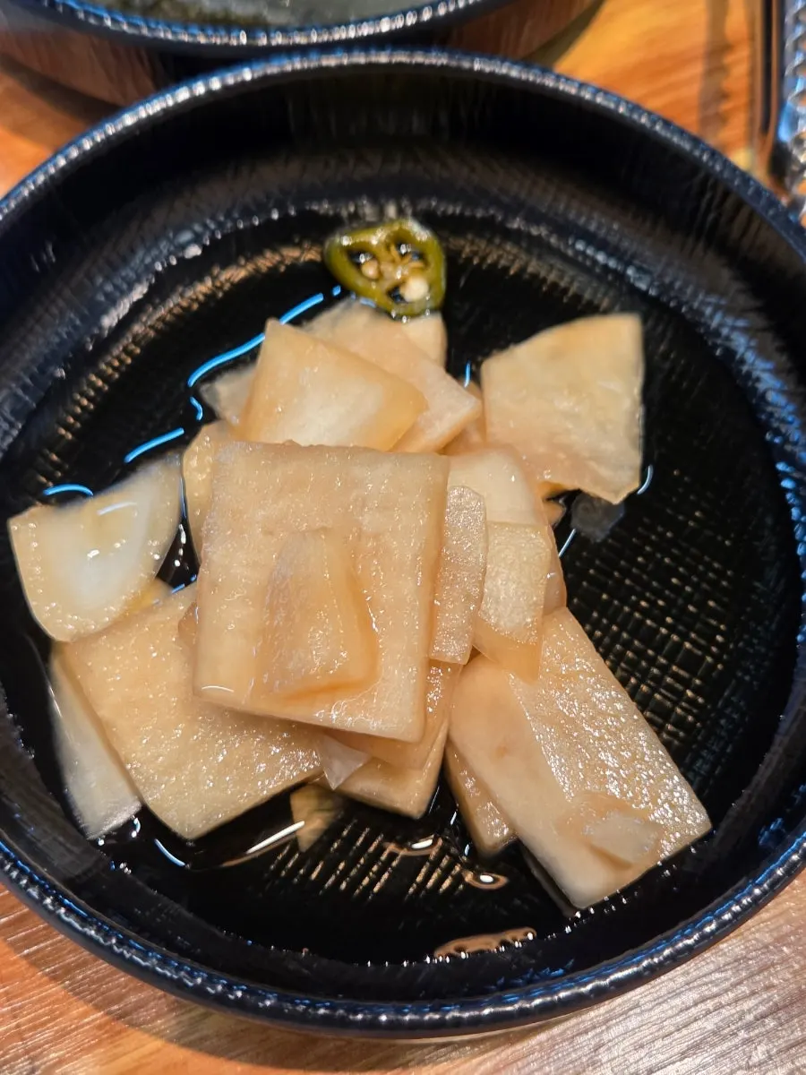 Scallion kimchi served alongside the eel
