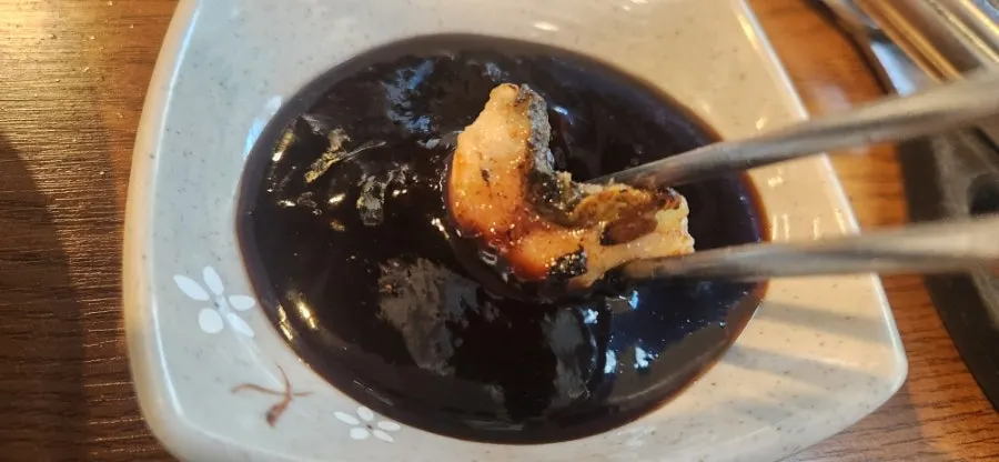 Golden eel dipped in salt