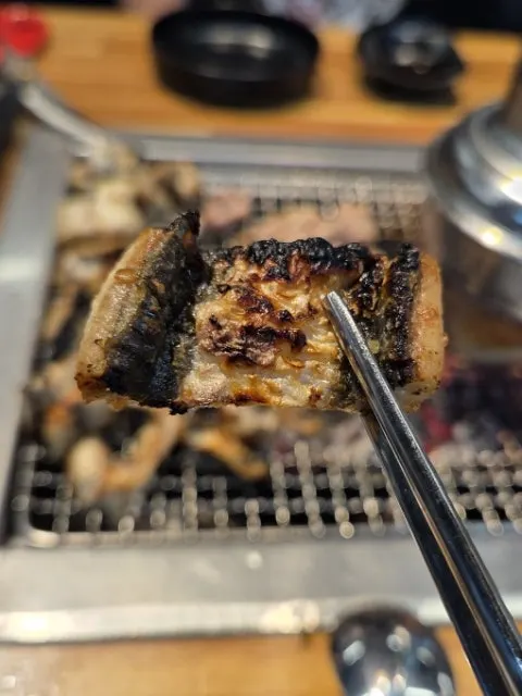 Eel cooking over charcoal