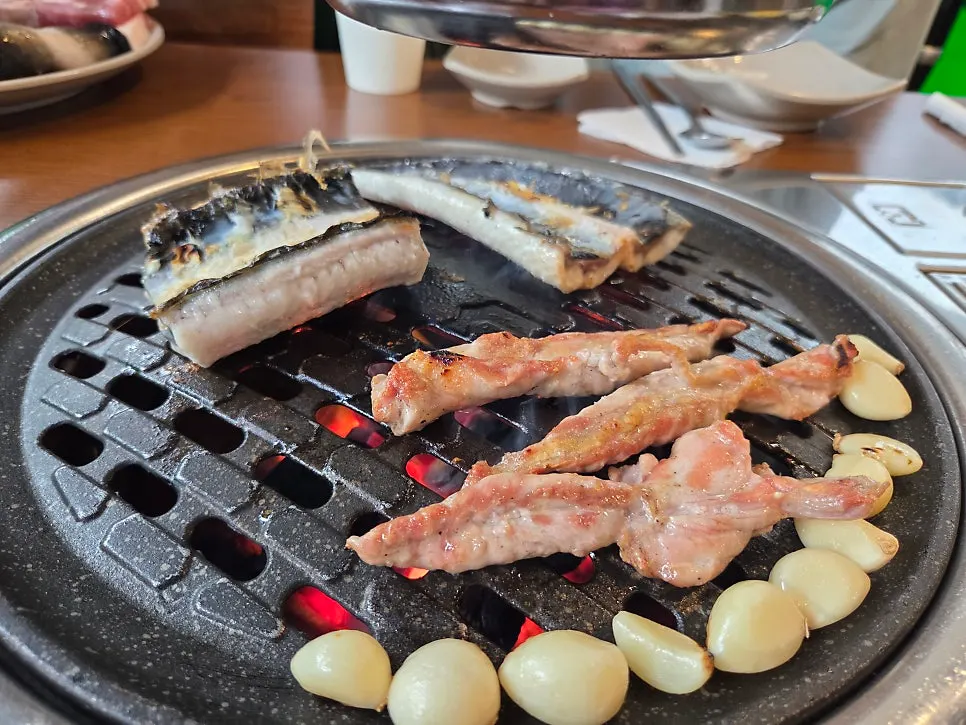 Pork belly and duck neck meat prepared alongside eel